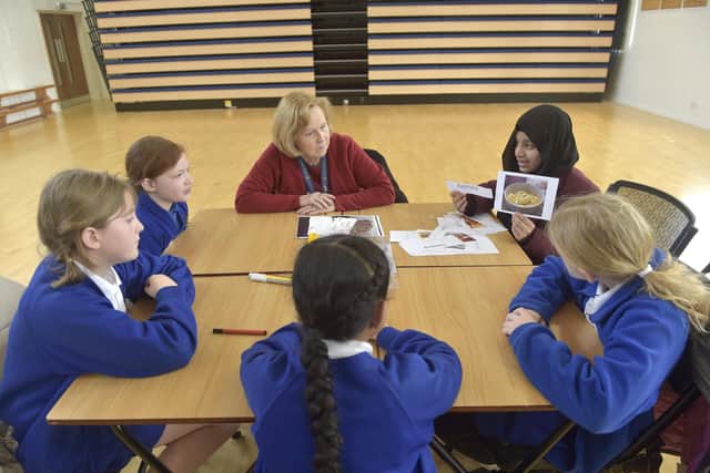 Pictured is: (back right) Portsmouth High School's Asiya Uddin with pupils and staff from St Jude's Primary School.
Picture: Sarah Standing (030223-9003)