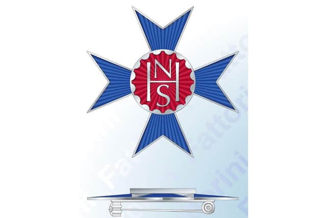 The NHS Cross medal designed by Hambledon-born artist Harry Gray