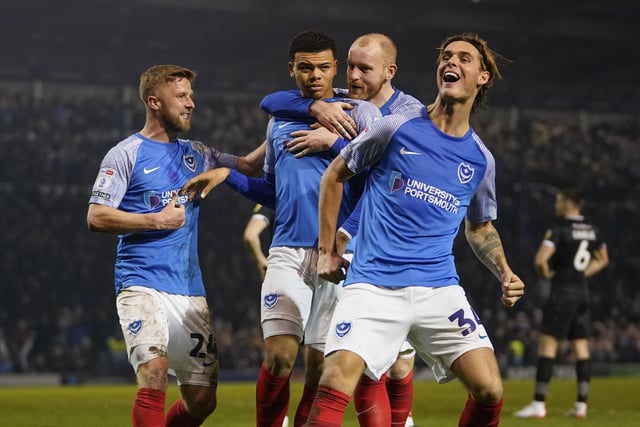 Dane Scarlett is congratulated by his team-mates following his late Pompey winner against Burton on Tuesday night
