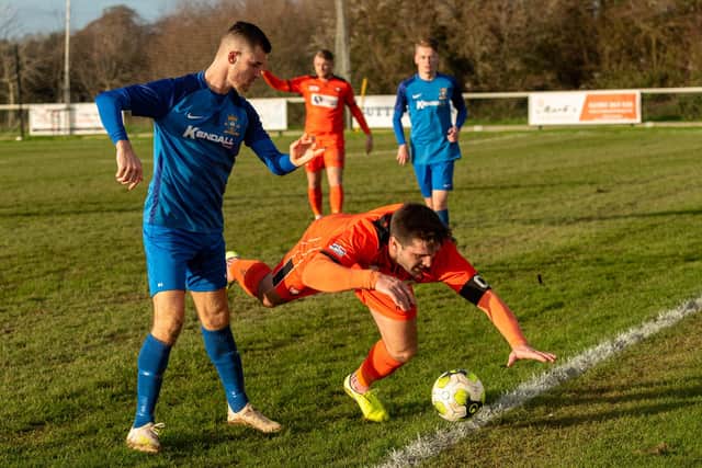 Ashton Leigh, left, in action for Baffins at AFC Portchester in February of this year. Picture: Vernon Nash