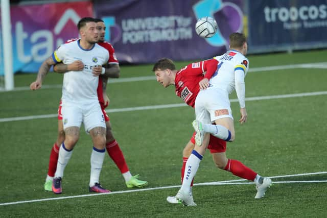 Alex Wall is held by a Hemel defender as Joe Oastler contests an aerial challenge. Picture: Dave Haines