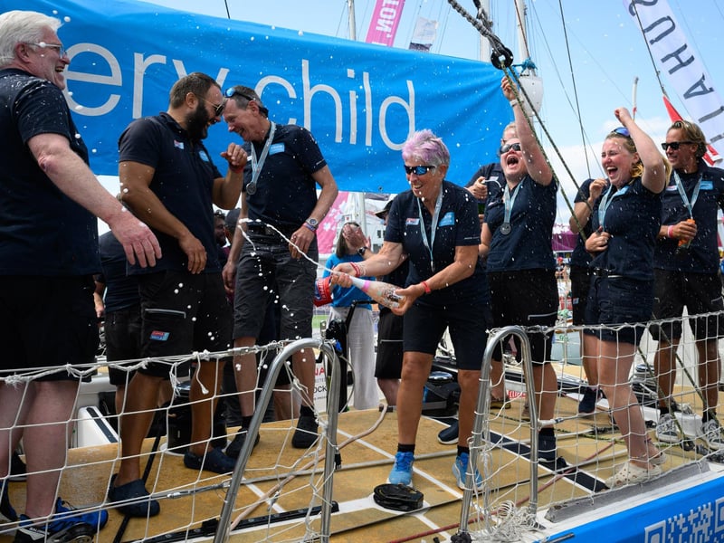 Crew members celebrate reaching the end of the race.Picture: Keith Woodland (270721-59)