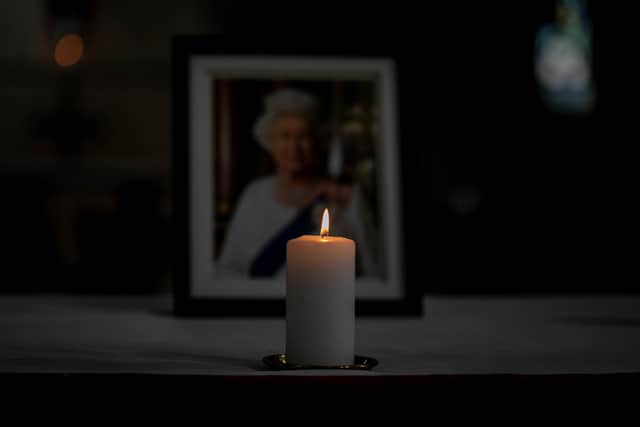 A candle lit in front of a picture of Her Majesty the Queen at Portsmouth Cathedral
Picture: Habibur Rahman