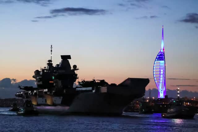 Pictured: HMS Queen Elizabeth ailing past Spinnaker Tower in Portsmouth for her maiden operational deployment.  The aircraft carrier will be supported by the new proposed supply ships. Photo: LPhot Rory Arnold/Royal Navy