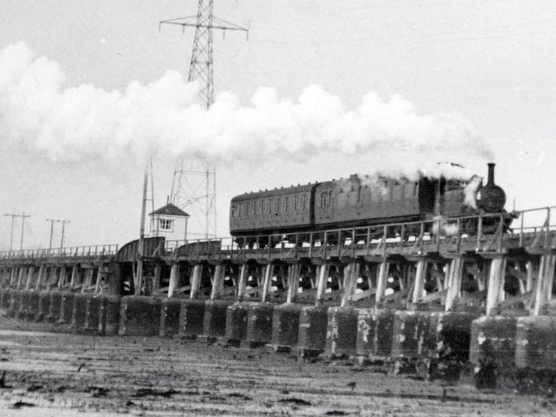 The Hayling Billy crosses Langstone Harbour at low tide.