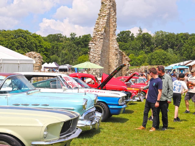 Visitors admiring cars at the Custom and American Show
