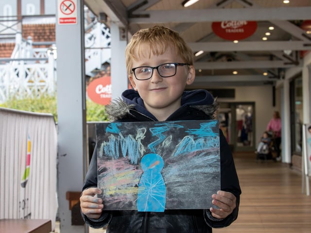 Visitors were treated to a Birds of prey display at Port Solent on Thursday, along with arts and craft for children.Pictured - Alistair Harper, 6 from Gosport showing off his artworkPhotos by Alex Shute