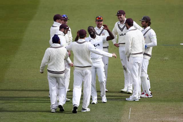 Surrey's Kemar Roach celebrates after dismissing Scott Currie at the Kia Oval on Saturday. Photo by Jordan Mansfield/Getty Images for Surrey CCC.