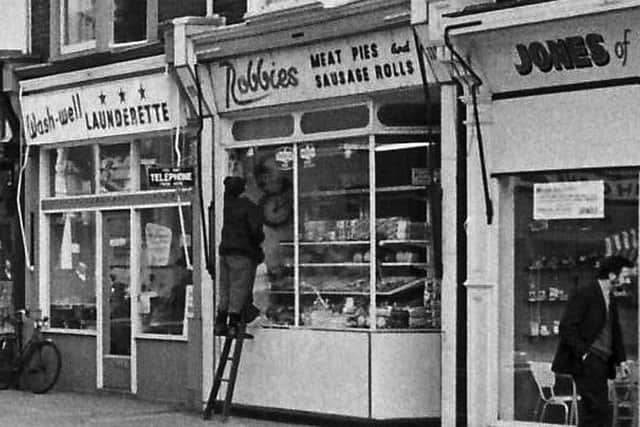 Fawcett Road, April 5, 1971. Wash Well Launderette, Robbies Meat Pies and Sausage Rolls, and Jones of Southsea.