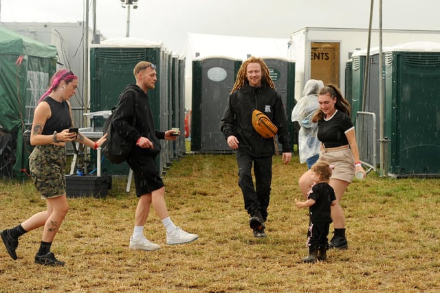 Festival goers dancing in the rain. Picture: Sarah Standing (310725-1249)