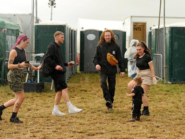 Festival goers dancing in the rain.  Picture: Sarah Standing (310725-1249)