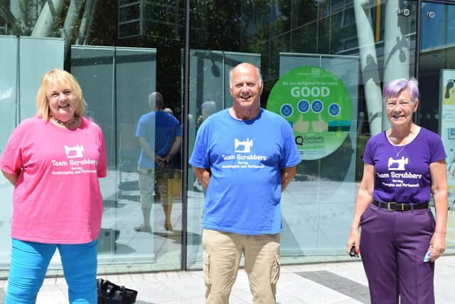 Team Scrubbers presented Queen Alexandra Hospital's neonatal wards with scrubs and masks made from the rainbow fabric designed to thank Noah Evans, son of radio DJ Chris Evans. Pictured: Lin Gell, Malcolm Dent and Julie Greenwood when they presented the scrubs to neonatal staff