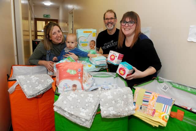 The Parenting Network, based in Portsmouth Guildhall, is planning to send an expedition team to the Polish border to supply aid to Ukraine.
Pictured is: (l-r) Shelly Crocker, chief operations officer for The Parenting Network and Portsmouth Baby Bank, David Moxey, fundraising manager, and Kelly Livingstone, family and young mums co-ordinator, with just some of the donations. Picture: Sarah Standing (010322-89)