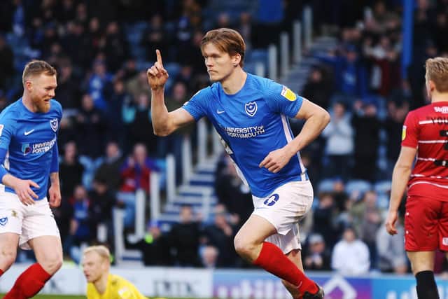 Sean Raggett celebrates scoring Pompey's fourth goal.