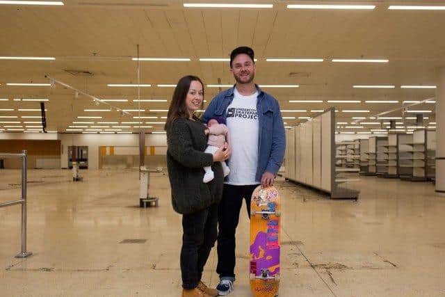 Jacob Skinner, fiancé Jenna Boyson, and baby Emi Skinner, in the former Sainsbury's store earlier this year. Picture: Olaiya Olufemi