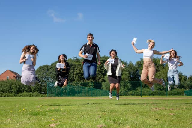 Pictured: Students at Portsmouth College - part of the newly-formed City of Portsmouth College - jump for joy after receiving their exam results.

Picture: Habibur Rahman