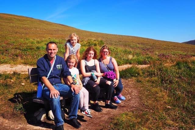 Sophie with her dad Gareth, mum Charlotte and sisters Lucy, 13, and Amelia, 8