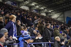 Pompey fans backed their team to a crucial Championship survival win over Cardiff last night.