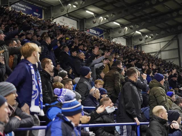 Pompey fans backed their team to a crucial Championship survival win over Cardiff last night.