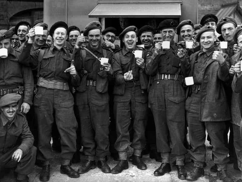 British army reinforcements enjoying a cup of tea before leaving for France. Pictured: June 14 1944 (Photo by Reg Speller/Fox Photos/Hulton Archive/Getty Images)