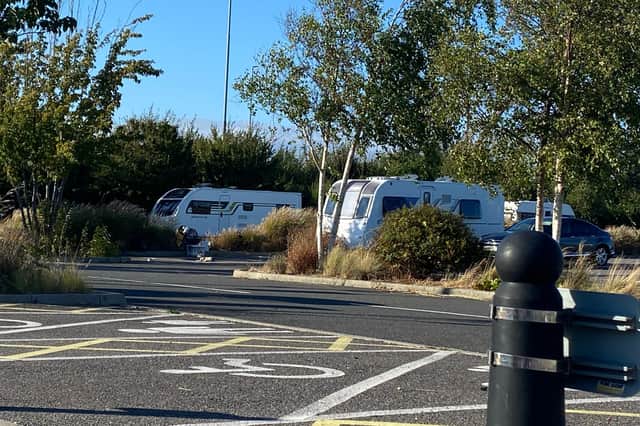Travellers pictured occupying Tipner's park and ride site. Photo: Tom Cotterill