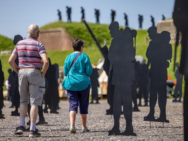 Visitors explore the installation at the Royal Armouries.
