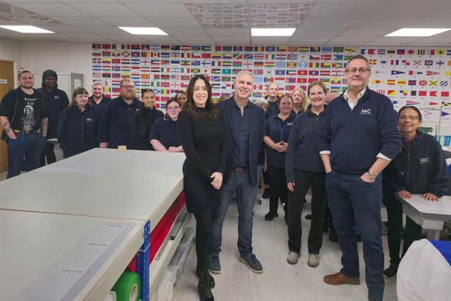 Dave Humphries of Shaping Portsmouth pictured with the team of HFC (Hampshire Flag Company)