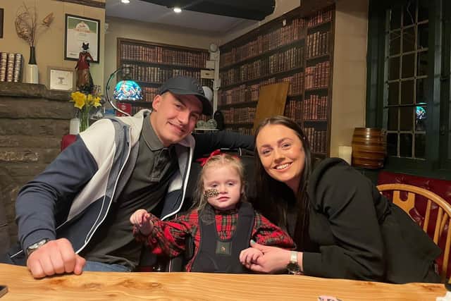 Pictured: Lowri James with her daughter Mia and partner Jack.