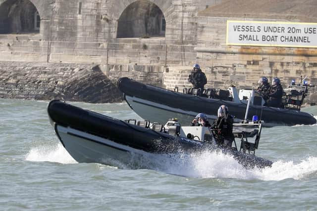 Police ribs escort the Royal Navy aircraft carrier HMS Queen Elizabeth leaves Portsmouth Naval Base in Hampshire as it sets sail for exercises at sea. Photo: Steve Parsons/PA Wire