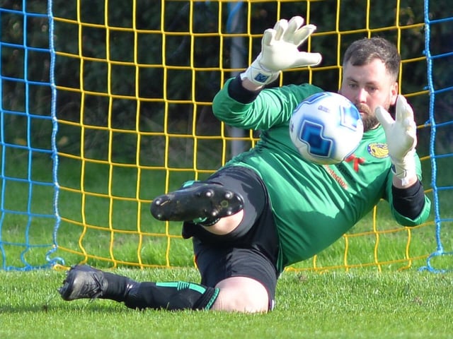Meon's keeper about to make a save in the shoot-out. Picture by Martyn White