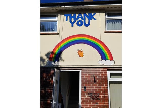 Rosie Deem, 14 from Gosport, is taking on a swimming, cycling and running challenge to raise funds for Cancer Research UK. Pictured: A rainbow of thanks which Rosie painted on her auntie's house