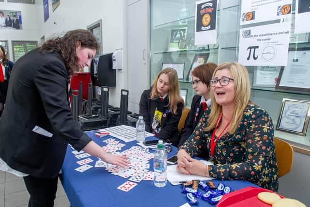 Emily Nutt,15, doing a Pi Challenge with fellow pupils and maths teacher, Georgie Harris. Picture: Habibur Rahman