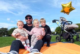 Paul Clilverd with his children, Maggie, 3, in pink, and Harry, 7, right, and the child of a family friend, Emmy, 1. Picture: Chris Moorhouse (jpns 240922-11)