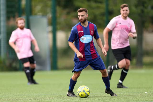 Josh Hazell, centre, on the ball for US Portsmouth reserves against Harvest Home. Picture: Chris Moorhouse