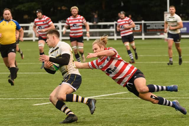 Havant's Rory Penfold attempts to pull back a Tunbridge opponent. Picture: Keith Woodland (111221-428)
