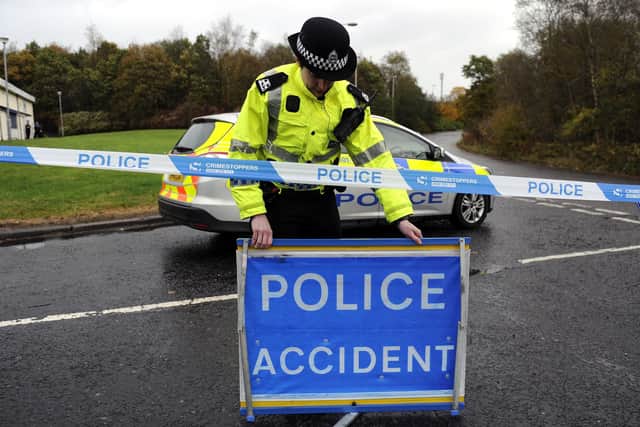 Police closed the road following the collision. Picture: John Devlin