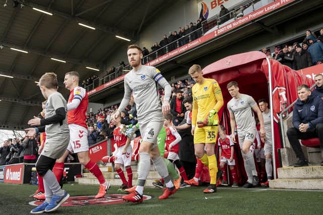 Pompey captain Tom Naylor leads Pompey out at Fleetwood's Highbury Stadium on Saturday.  Picture: Daniel Chesterton