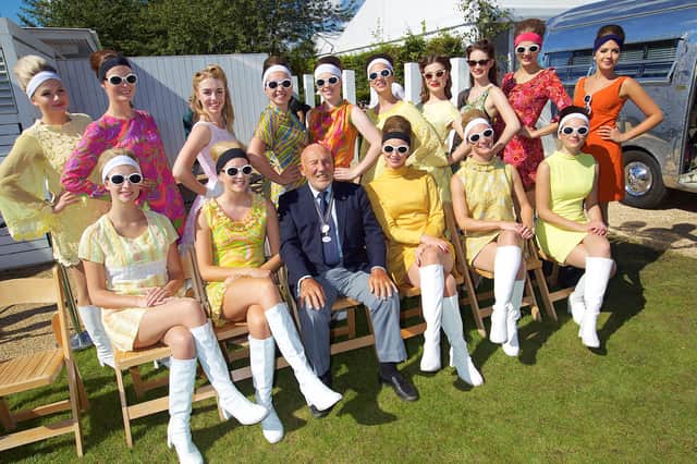 Sir Stirling Moss with the Class of 2016 Grid Girls at the Goodwood Revival. Pic: Michael J Reed