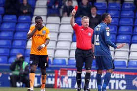 Pompey's Sam Sodje gets his marching orders from referee Mark Heywood against Oldham in February 2013