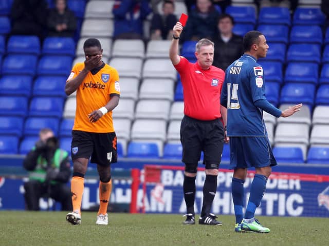 Pompey's Sam Sodje gets his marching orders from referee Mark Heywood against Oldham in February 2013