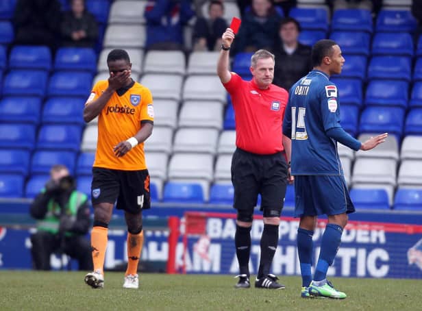 Pompey's Sam Sodje gets his marching orders from referee Mark Heywood against Oldham in February 2013