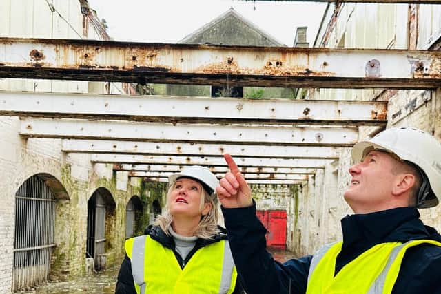 Gosport MP, Dame Caroline Dineage with UK Docks' Ben Mason at the derelict former Rum Store.