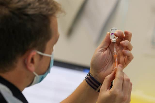 A Royal Navy medic administering a Covid-19 vaccines in Bristol Picture: L/Phot Oates / Royal Navy