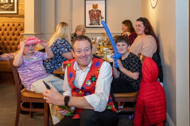 Magician Roy 'Magic Charlie' Charles provides entertainment during the opening of the Brewers Fayre. Picture: Mike Cooter (040323)