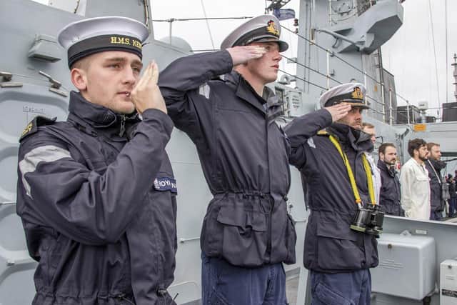 Sailors of HMS Kent salute Nato ships during a sail past following a war game in the northern Atlantic. Photo: LPhot Dan Rosenbaum