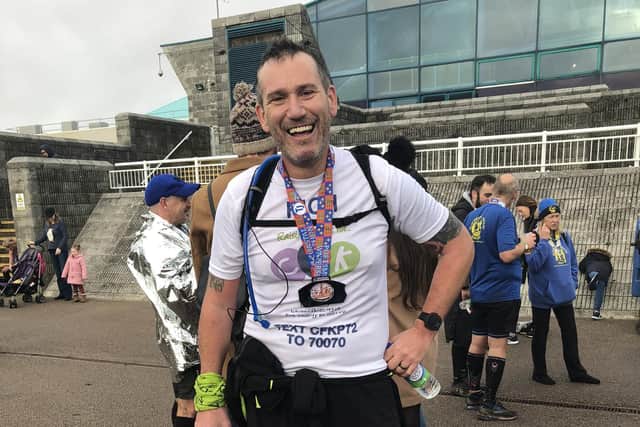 Rich Harris at the finish line of the Portsmouth Coastal Marathon
