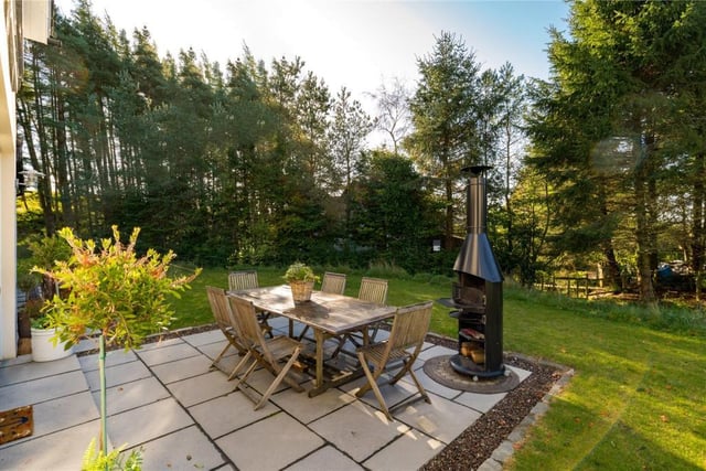 Outdoor entertaining area, paved with flagstones and accessed from the kitchen.