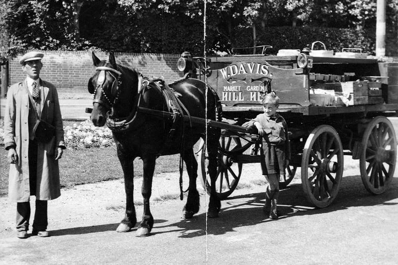 Bob Davis's dad who was a green grocer and Bob looking proud, taken on the corner of Portsmouth Road outside what was then Bennetts Paper shop, the horses name was Joey. Dad looked very smart with a white shirt and tie, with his money bag, I was eight which means this photograph was taken in 1950 says Bob.