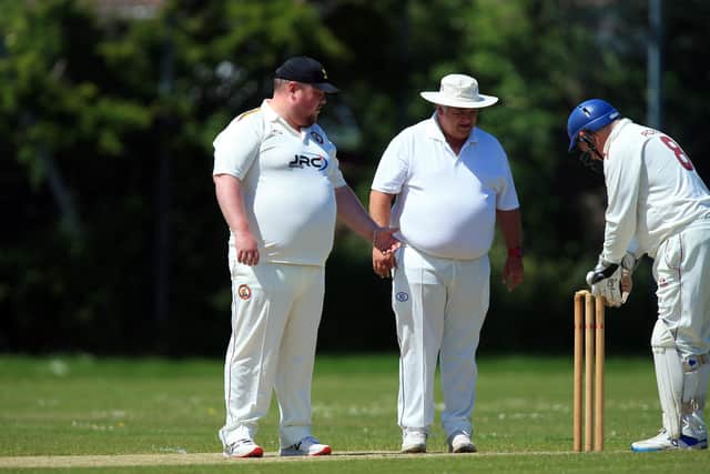 Bails are discussed and the stumps are set to be replaced after Denmead opener Matthew Barnard was dismissed in the Hampshire League game against Gosport Borough 4ths at Privett Park.
Picture: Chris Moorhouse