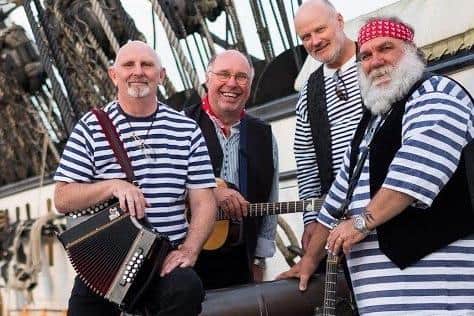 Shep Woolley, second from left, with the 'Ansome Cabin Buoys.